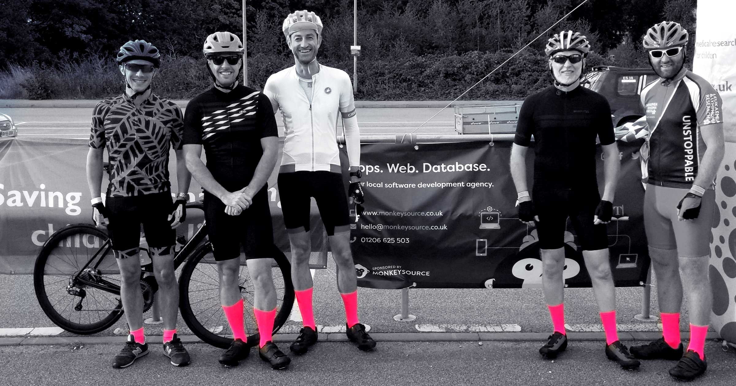 An image showing the team before the race, wearing pink socks